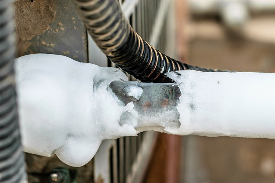 Frozen evaporated coils on an air conditioning unit in the Metro East and requiring professional repair services.
