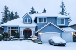 A residential home in the Metro East that is covered in snow from a snowstorm and heated thanks to a quality furnace system from our HVAC experts.