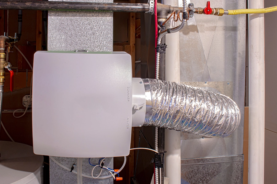 a humidifier attached to an air duct in the home of a Metro East Area, IL resident to help tackle the dry air.